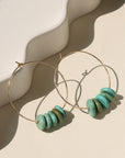 Desert Sky Hoops featuring hammered gold filled with teal green turquoise bead accents.