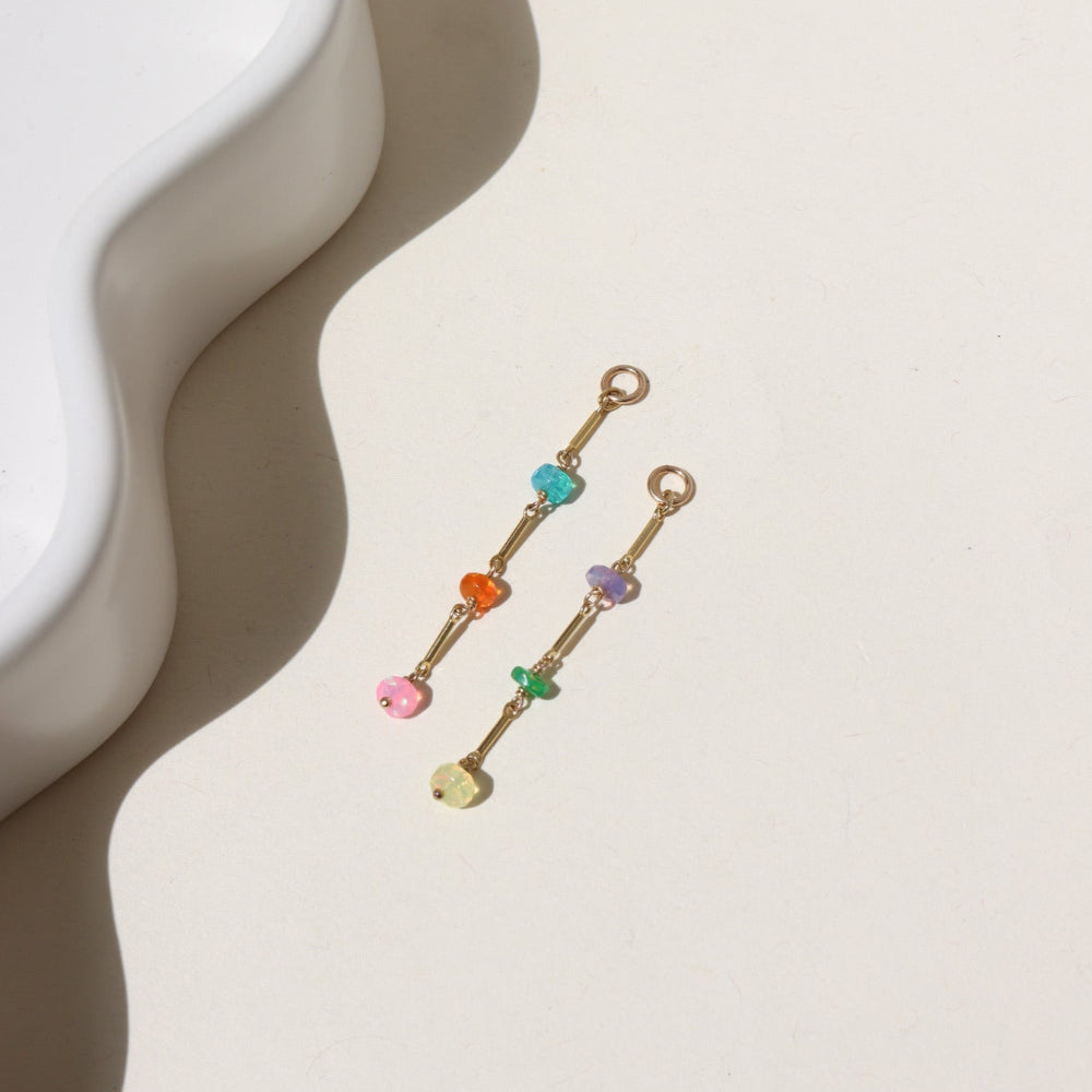 Disco Opal Earrings featuring six multicolored opals on a bar, dot, and dash chain design in gold fill