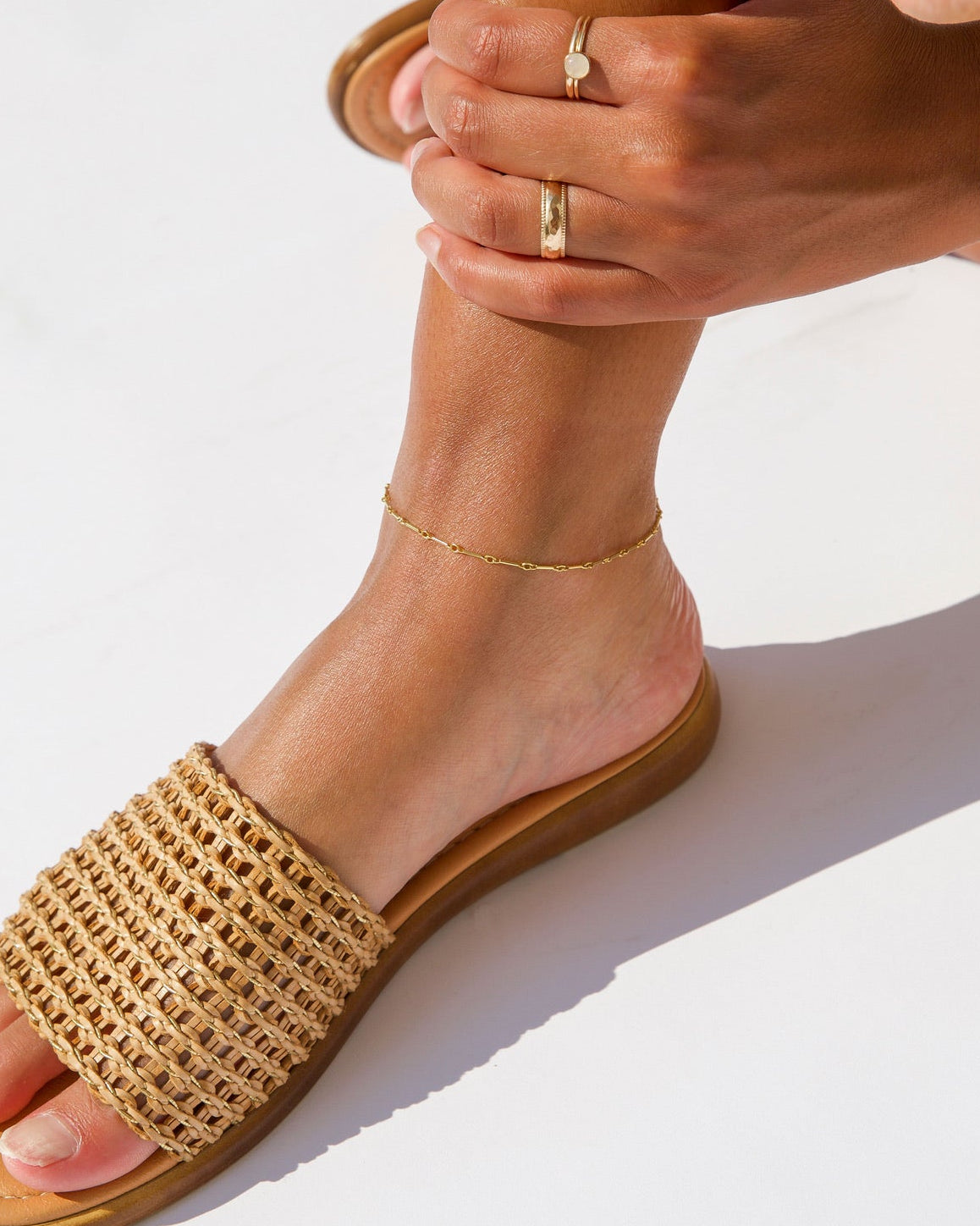 model wearing 14k gold fill bar and link anklet 