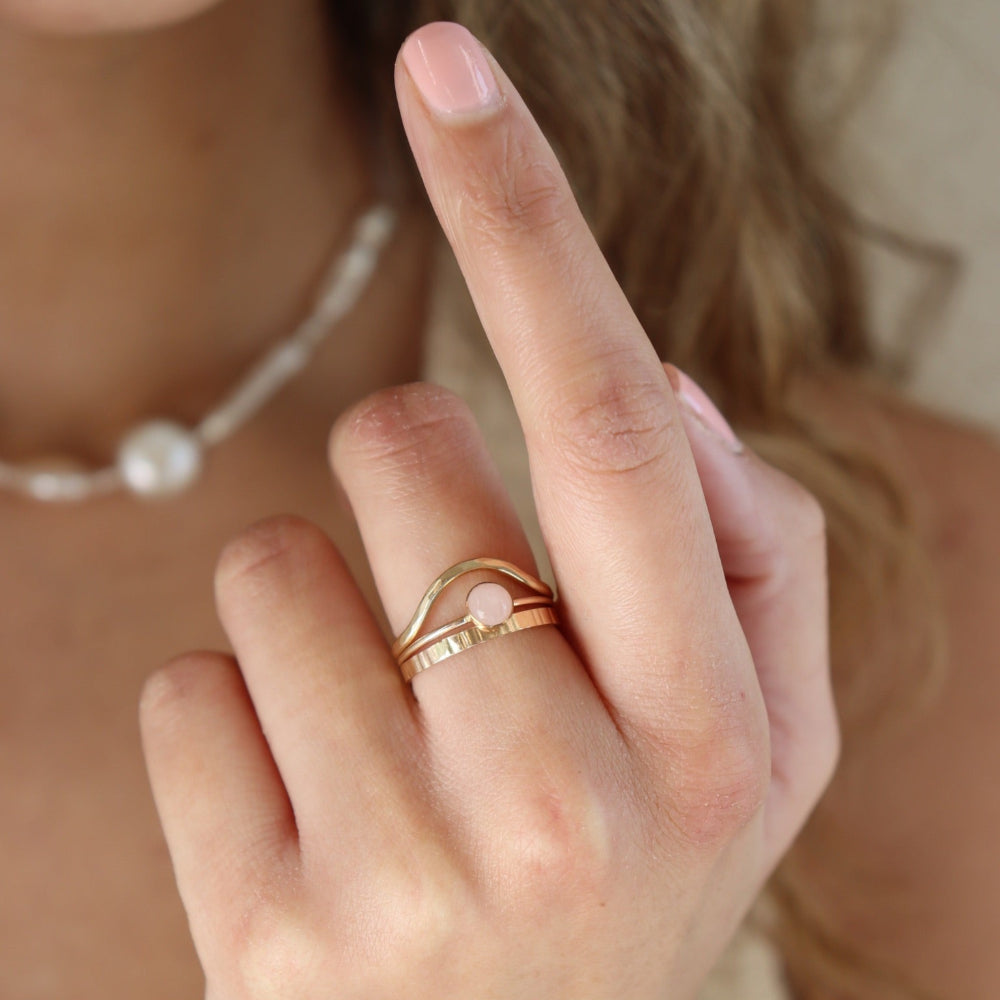 Rose Quartz Ring in 14k gold fill on model and stacked with other rings.