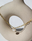 Eden anklet in 14k gold fill  on a tan pot