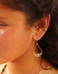 Model wearing The Estella Earrings feature moonstone, kunzite, and citrine drops on a gold fill or sterling silver chain. 