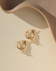 delicate gold fill hoops with dangling cubic zirconium