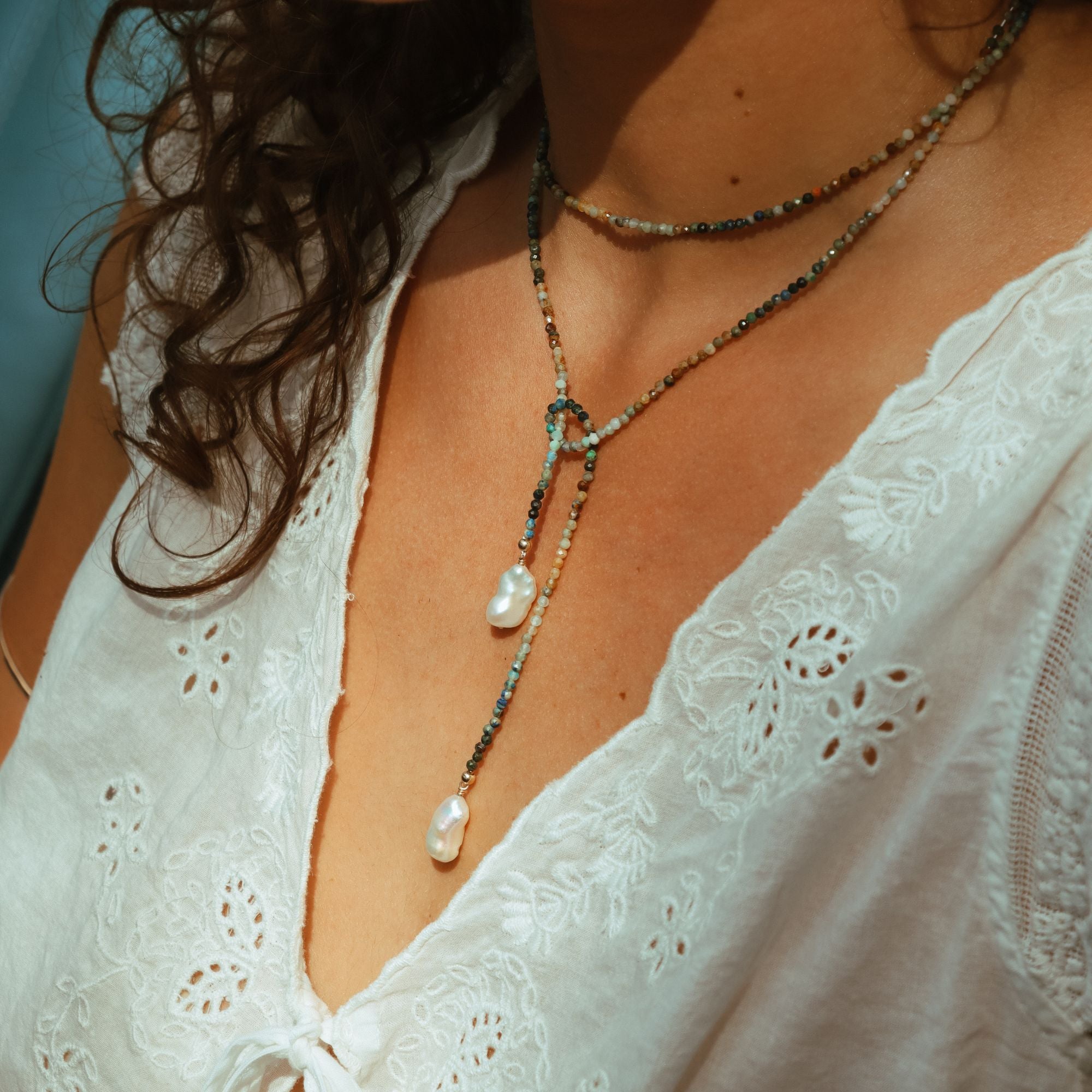 model wearing beaded wrap necklace