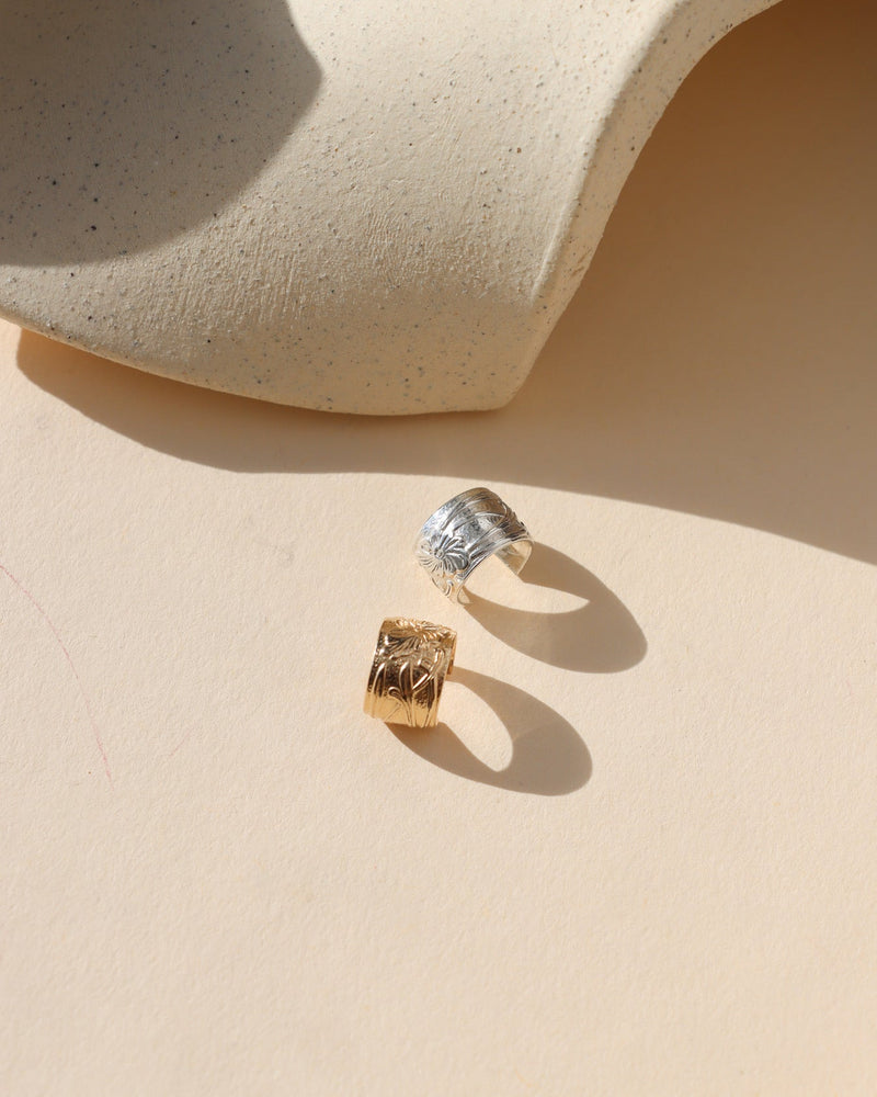 14k gold fill and sterling silver textured ear cuffs in the sunlight