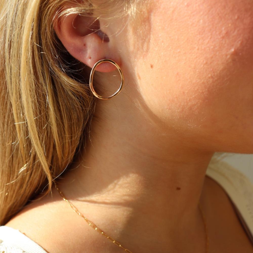 Form Studs in 14k gold fill worn by a model 