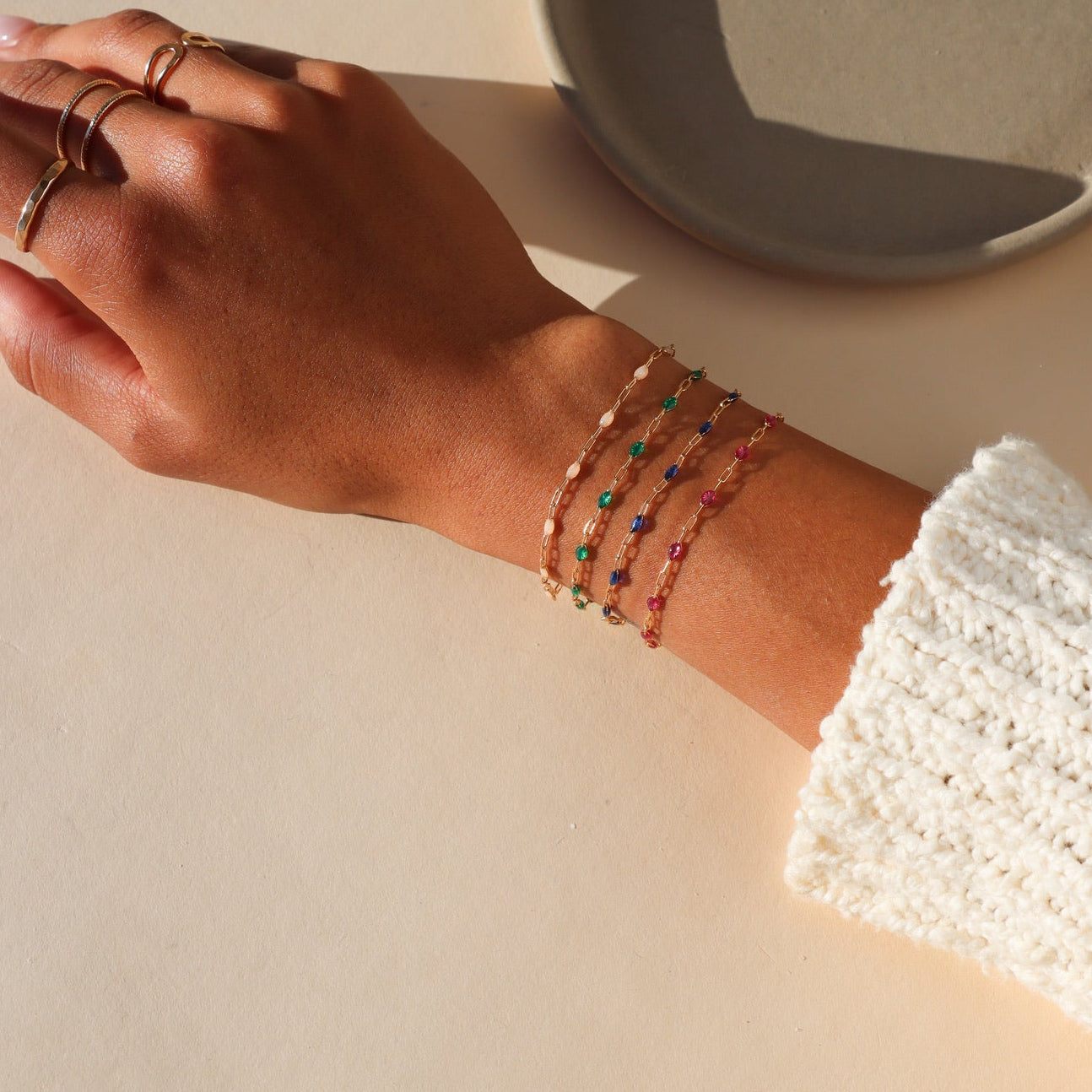 close up of model wearing gemlink bracelets