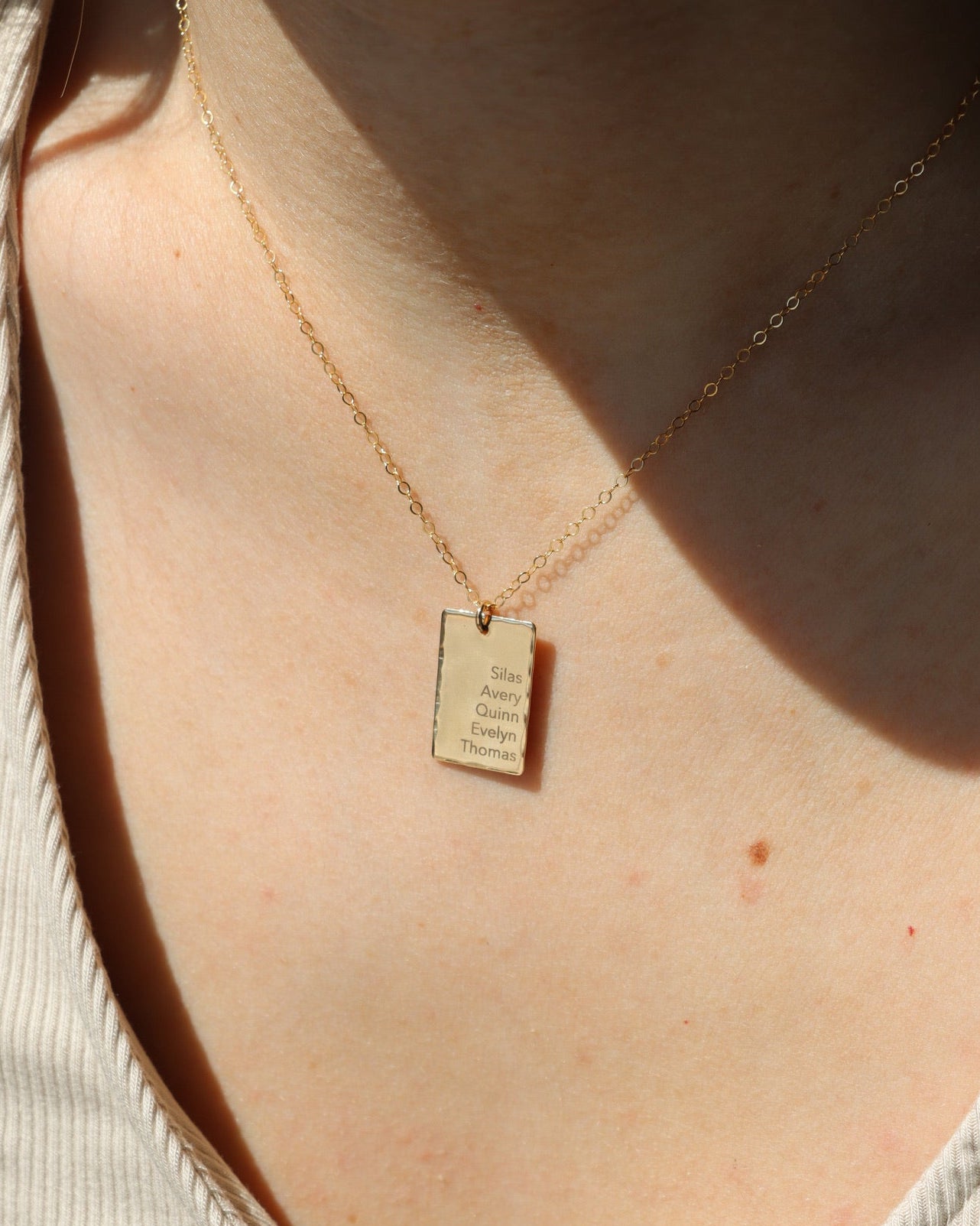 Gold fill Keepsake necklace engraved on a model