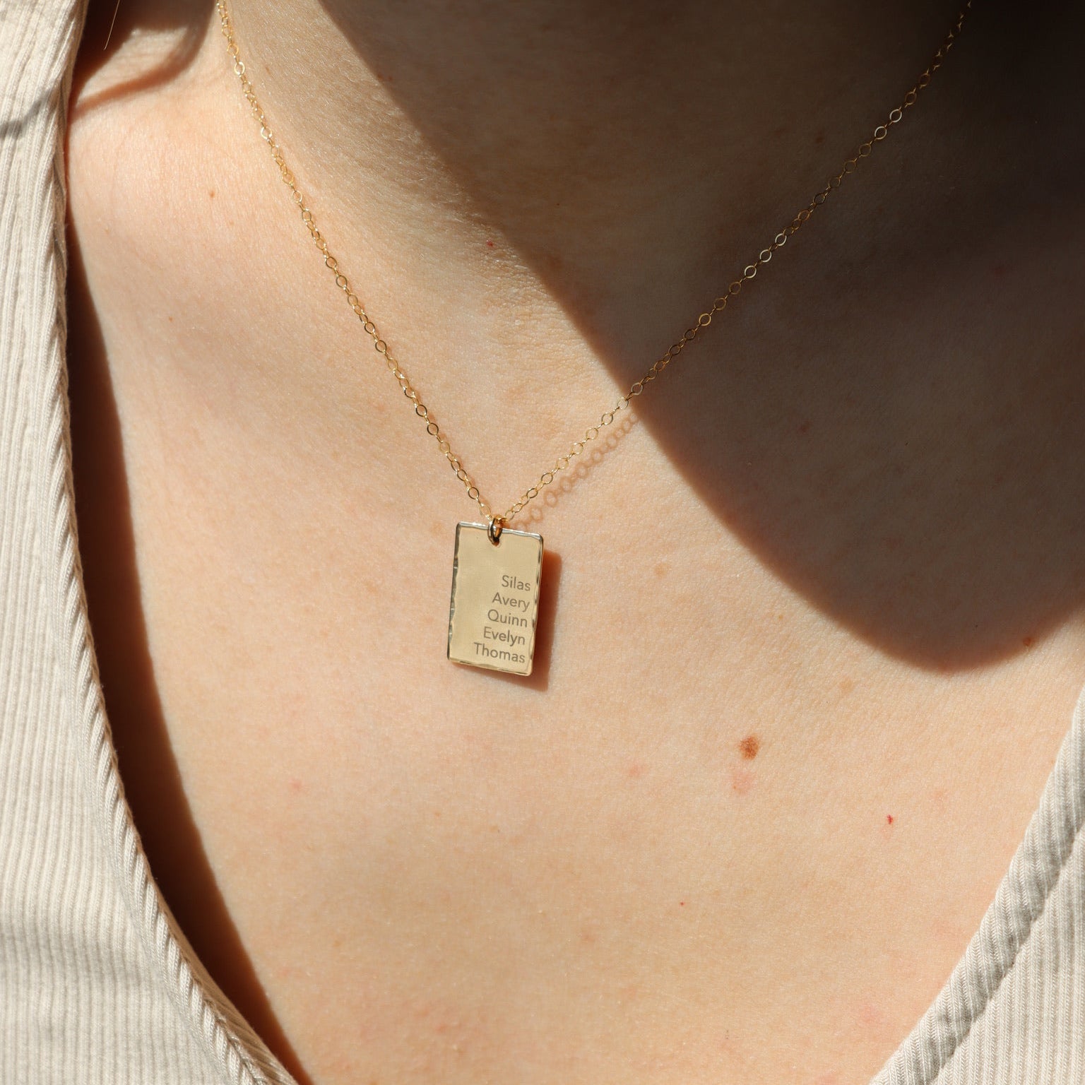 Gold fill Keepsake necklace engraved on a model