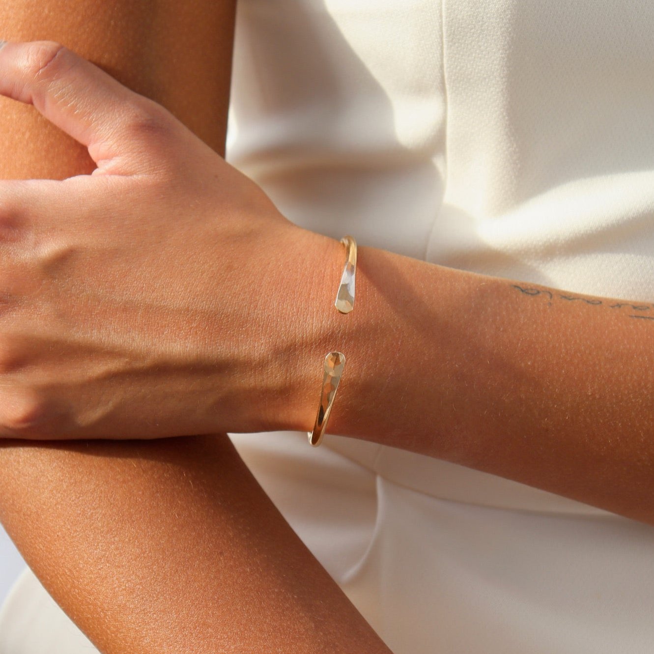 model wearing 14k gold fill hammered cuff bracelet