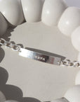 925 sterling silver Name plate bracelet with Alexandra chain. This bracelet features a simple plate you can choose to have hammered or have smooth. This bracelet is then connected with the Alexandra chain. With this bracelet it features the option of adding a name or not.