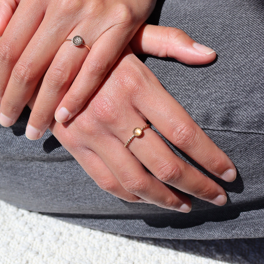 Model Wearing 14k gold fill Gaia Ring. This ring features a Spiral band with a zircon gemstone.