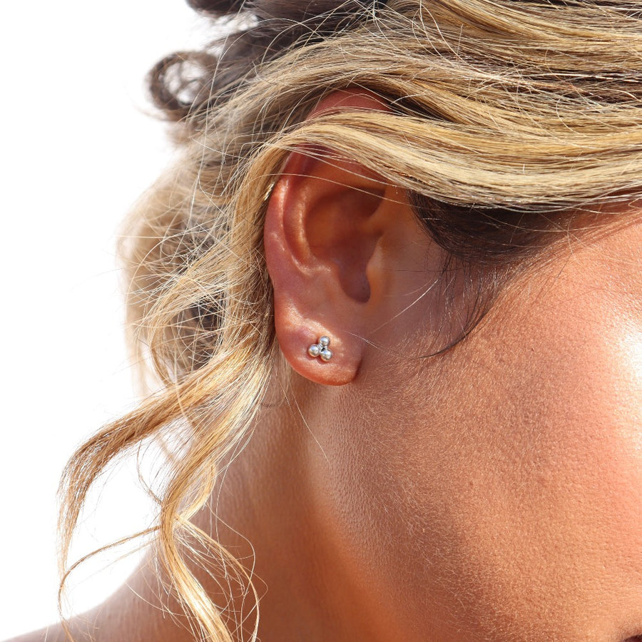 Model wearing 925 sterling silver element studs