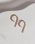 14k rose gold fill "nine" earrings smallest size laying side by side