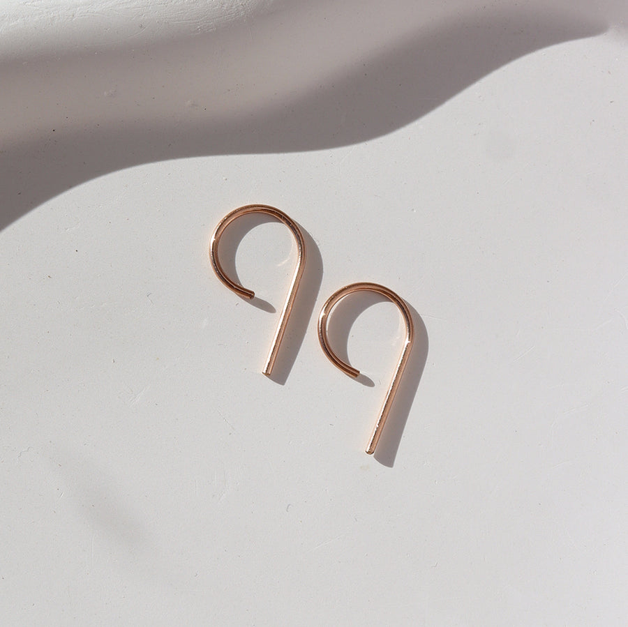 14k rose gold fill "nine" earrings smallest size laying side by side