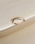 dainty hammered rose gold stacking ring handcrafted by Token Jewelry in Eau Claire, Wisconsin