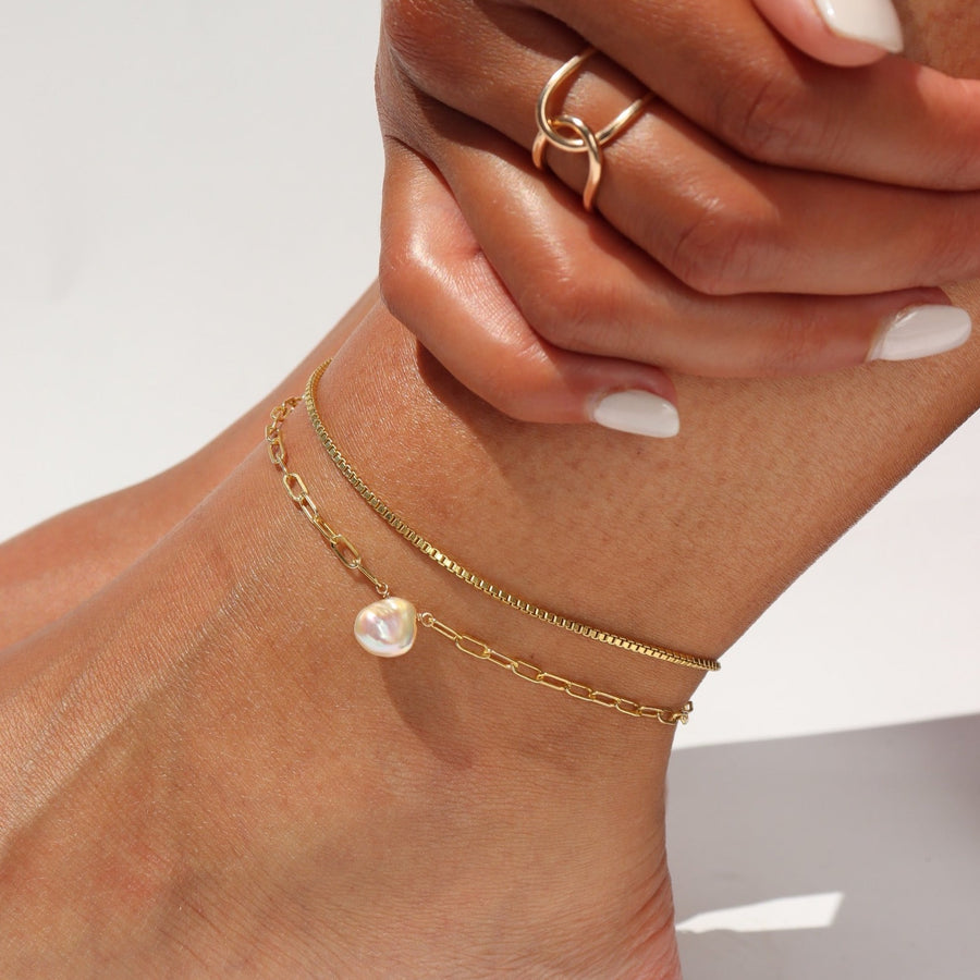 Model wearing a 14k gold fill Delaney anklet