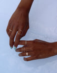 Model wearing 14k Gold fill Sunburst Infinity Ring in the water.