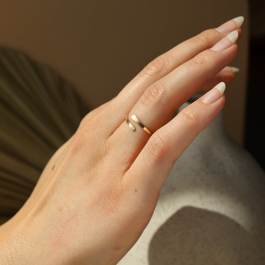 dainty hammered wrap coil ring on model handcrafted by Token Jewelry in Eau Claire, Wisconsin