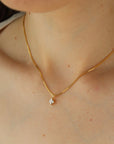 square cut cubic zirconia pendant set in a gold filled bezel and hanging from a delicate box chain.