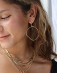 Model wearing 14k gold fill Form Hoops