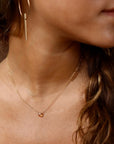 Model wearing 14k gold fill Peach Zircon Necklace