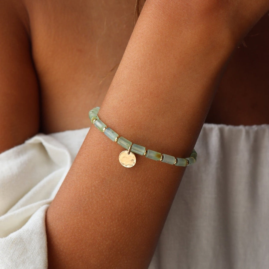 Model wearing 14k gold fill Ada coin Bracelet