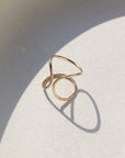 Isla Ring laid on a white plate in the sunlight.