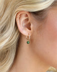 Model wearing 14k gold fill 14mm hoop with a Jade ball gemstone dangling from it. 