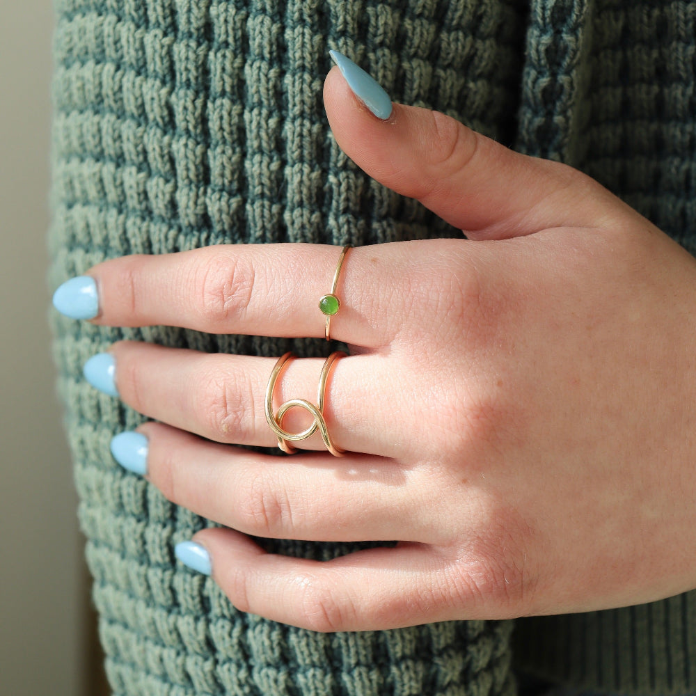 Model wearing 4mm Jade Gemstone Ring set in a 14k gold fill bezel with simple hammered ring band.