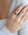 Model is wearing a 14k gold fill entwined band with a 8x10 jade gemstone in a gold bezel. 