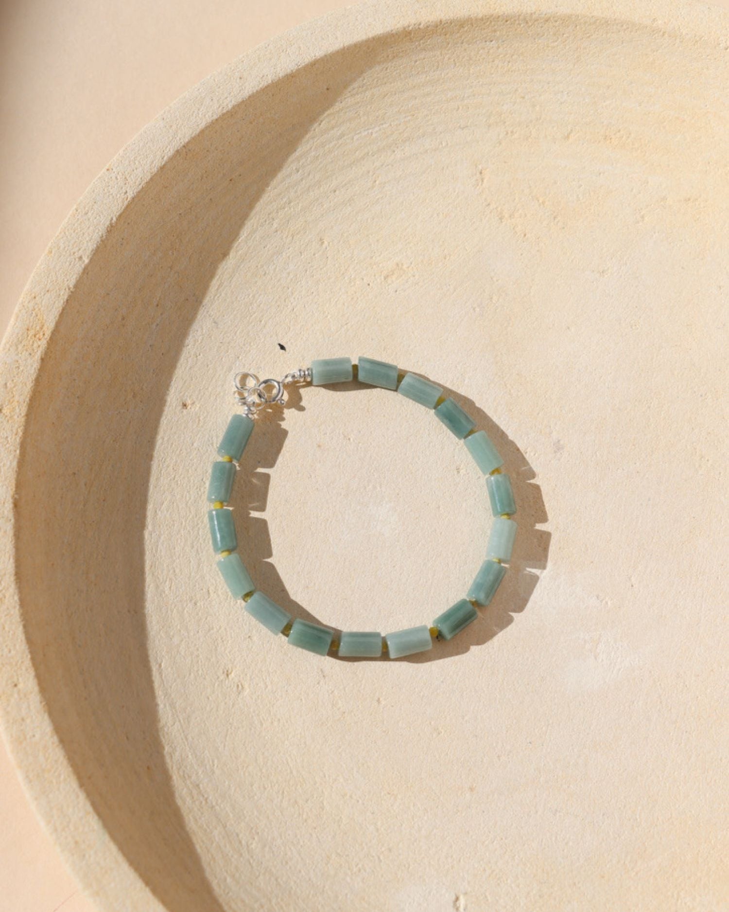 Jade and Serpentine gemstone beads alternate to make a bracelet with sterling silver fixings