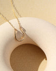 14k gold fill Lucky Charm Necklace. This Necklace features a horseshoe shape with hammering on one side. The horseshoe meaning lucky is connected with the simple chain.