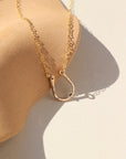 14k gold fill Lucky Charm Necklace. This Necklace features a horseshoe shape with hammering on one side. The horseshoe meaning lucky is connected with the simple chain.