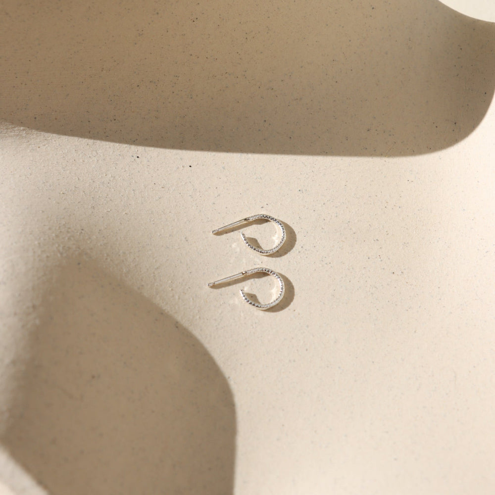 Mini Lumen Hoops — 14K gold fill or sterling silver hoops with a delicate sparkling wire, lightweight and perfect for stacking or wearing solo.