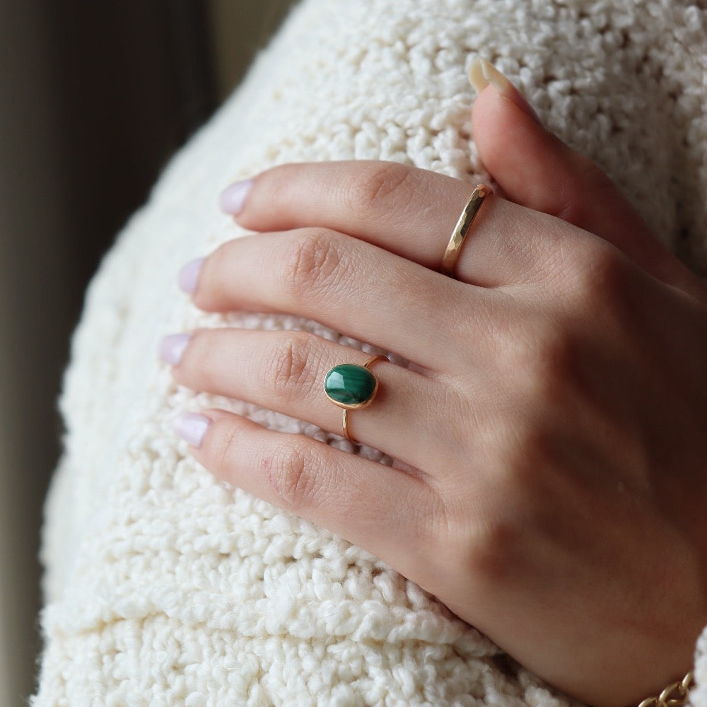 sterling silver ring with a green malachite stone, photographed on a model | handmade by Token Jewelry in Eau Claire, Wisconsin