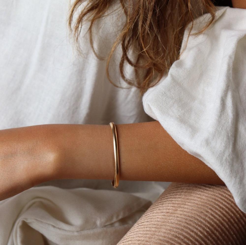 Model wearing 14k gold fill Hammered Cuff