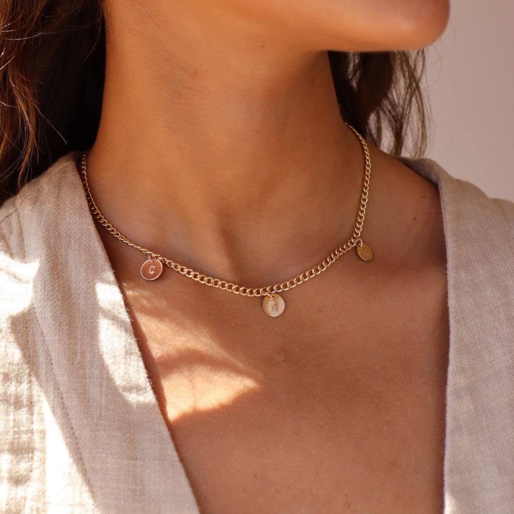 Model wearing 14k gold fill Modern Muse initial necklace.This Necklace feature our Demi Alexandra chain featuring a charm initial of your choice.
