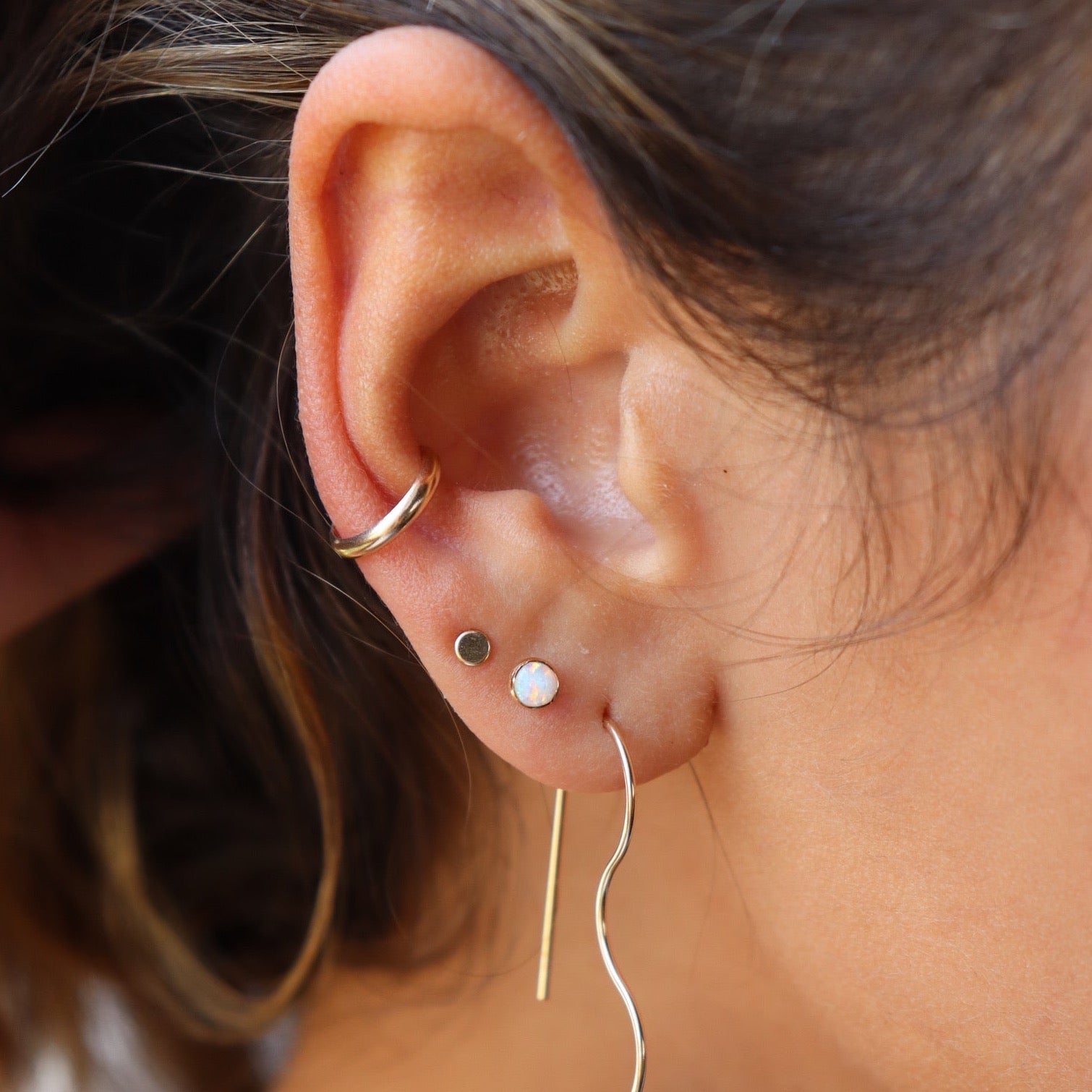 Model wearing 14k gold fill simple ear cuff 