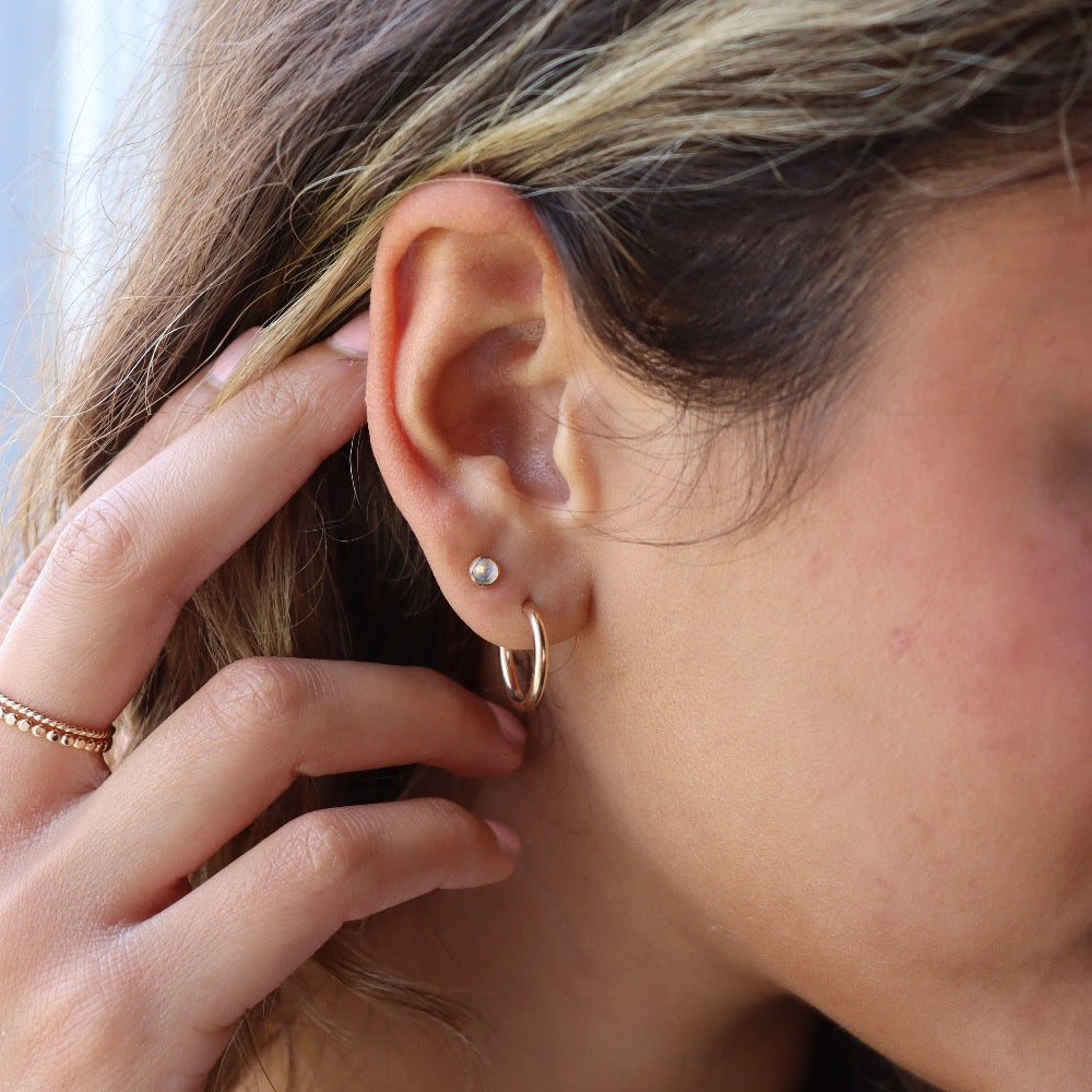 Model wearing 14k gold fill Moonstone studs