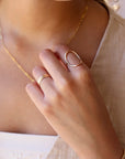 model wearing 14k gold fill circle ring.