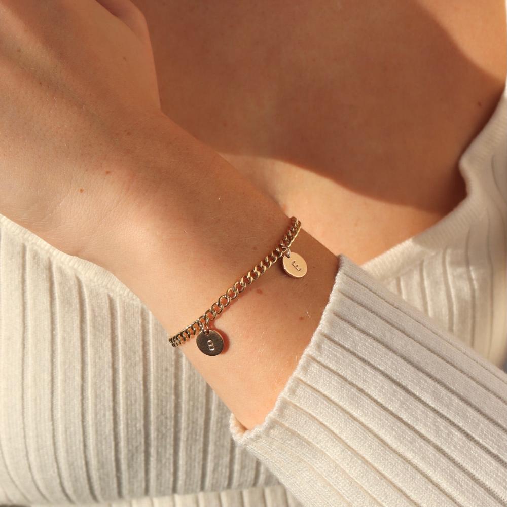 model wearing 14k gold fill curb chain bracelet with hand stamped disc charms 