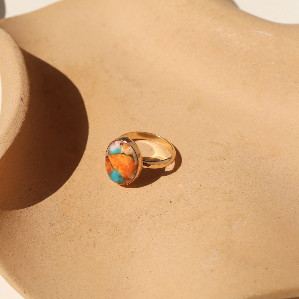 Mojave Turquoise Ring with a blend of turquoise, spiny oyster shell, and copper set on a textured hand-hammered band.