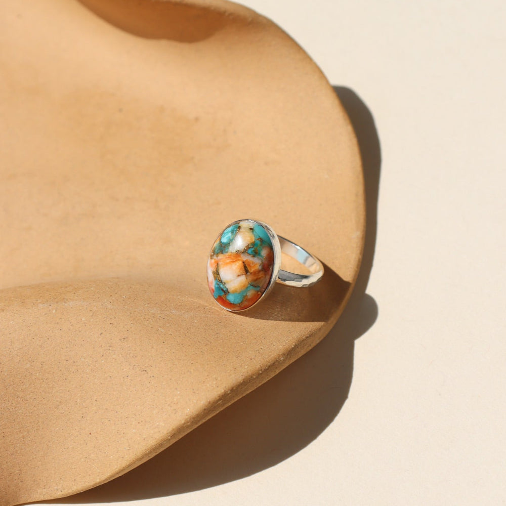 Mojave Turquoise Ring with a blend of turquoise, spiny oyster shell, and copper set on a textured hand-hammered band.