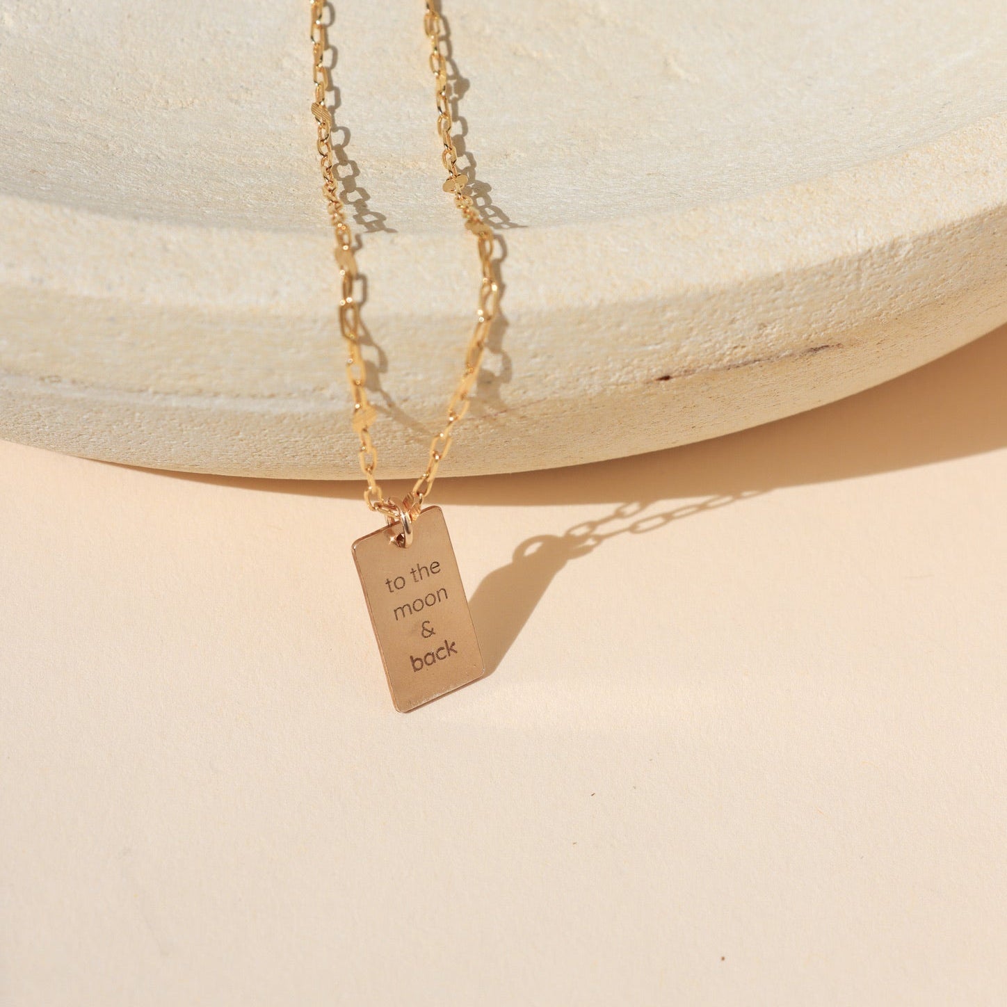 14k gold fill delicate chains with engraved phrase "to the moon & back"