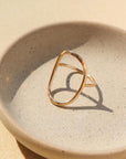 14k gold fill hammered oval ring on a light dish