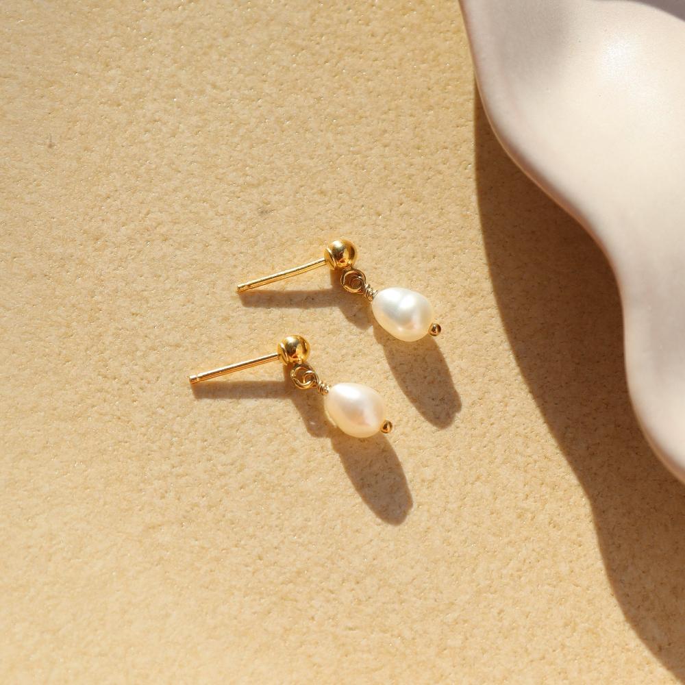 delicate handmade pearl drop stud earrings. made by Token Jewelry in Eau Claire, wisconsin