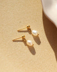 delicate handmade pearl drop stud earrings. made by Token Jewelry in Eau Claire, wisconsin