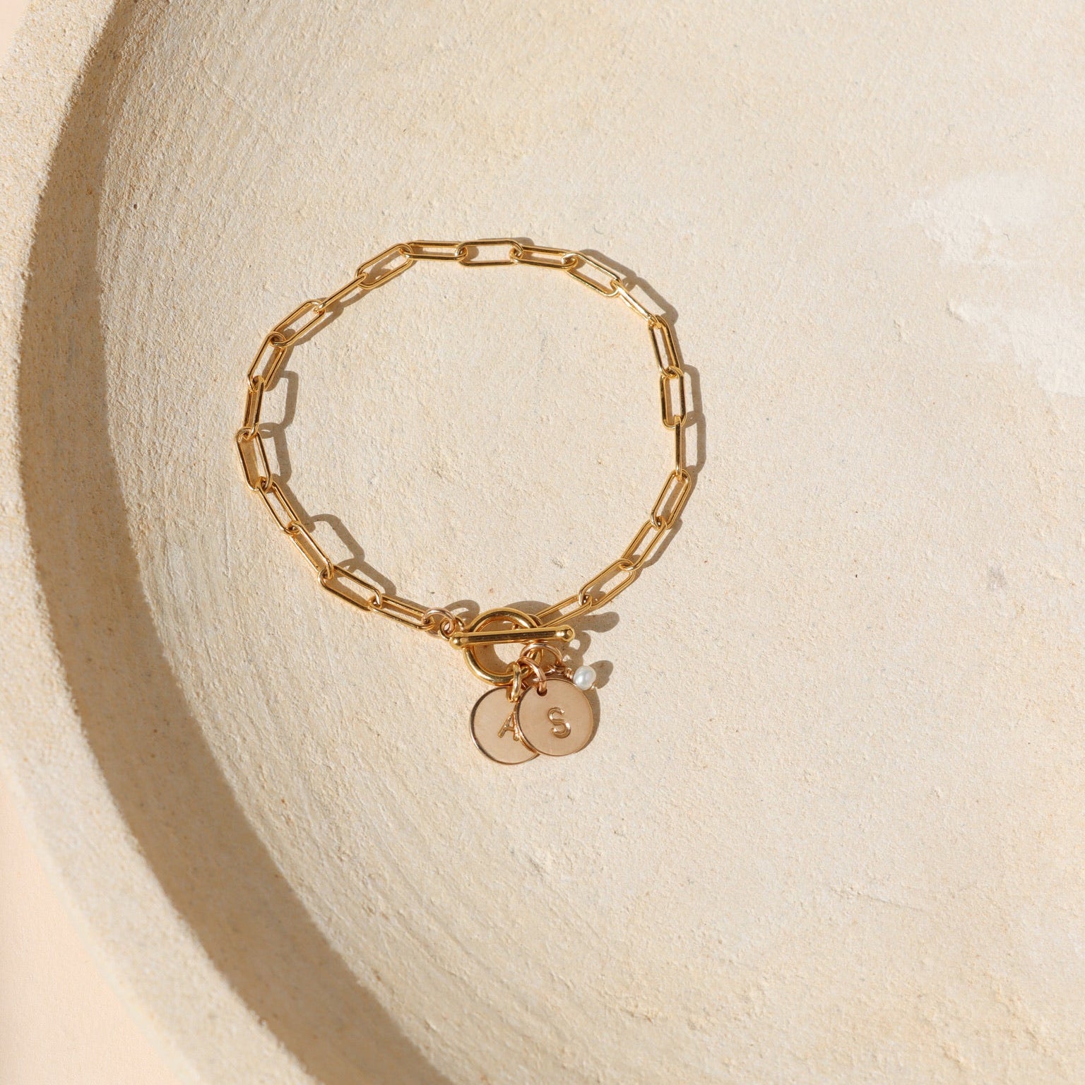 14k gold fill chain bracelet with toggle clasp and 2 personalized discs on a light background