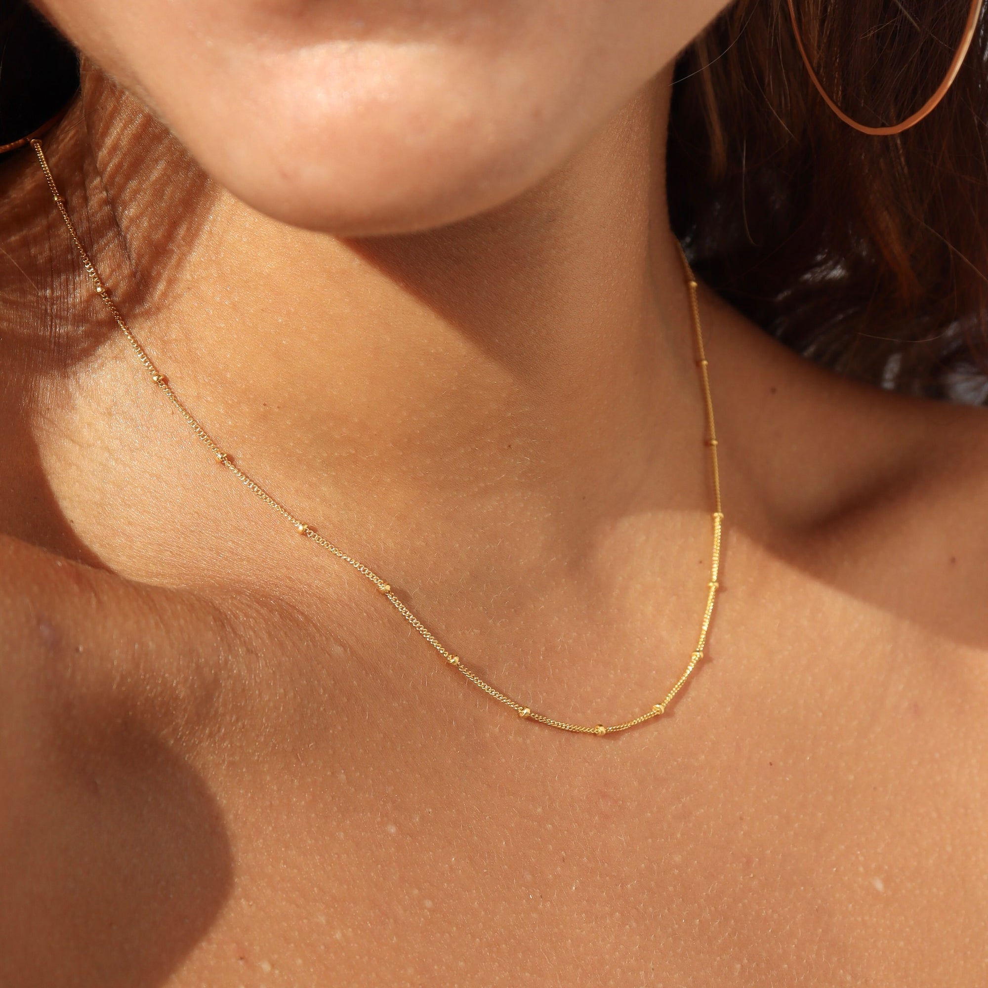 model wearing 14k gold fill chain necklace 